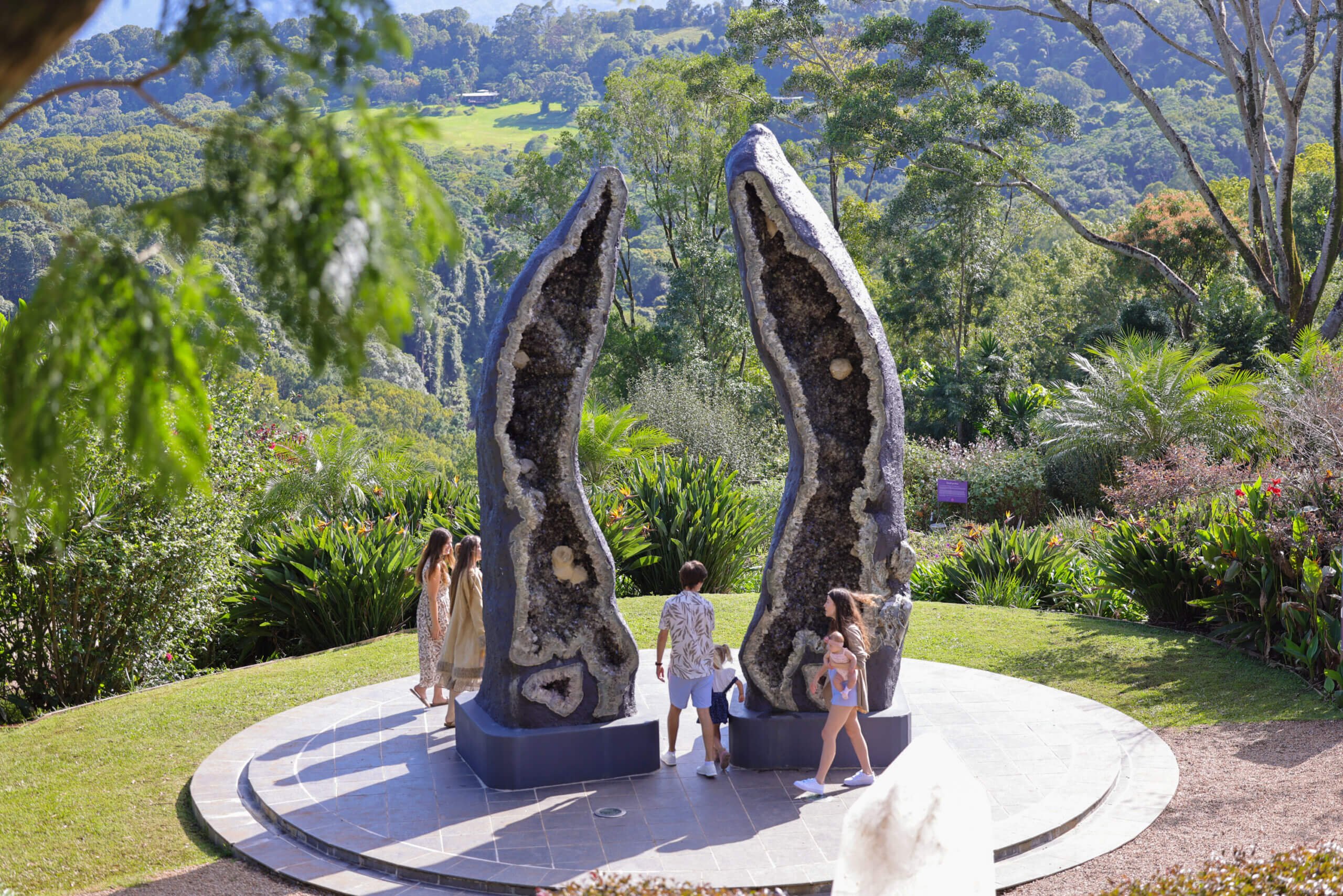Families enjoying the Crystal Guardians, valley behind
